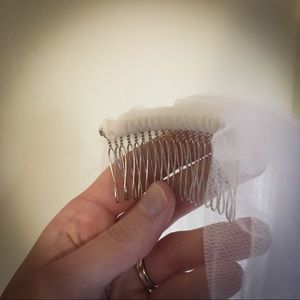 Long white chapel length bridal veil.